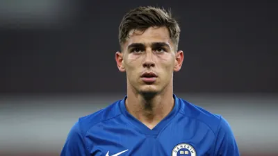 A photorealistic portrait of a 29-year-old defensive midfielder in a solid blue jersey, waist-up, intense expression...
