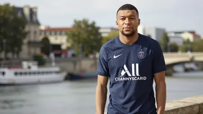 A mid-30s anonymous Paris FC player, waist-up, wearing the new navy home kit with smooth fabric, standing in front of a...