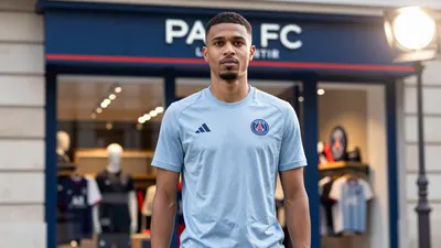 A photorealistic image of an anonymous Paris FC staff member, wearing a light blue Adidas tunic, standing in front of a...