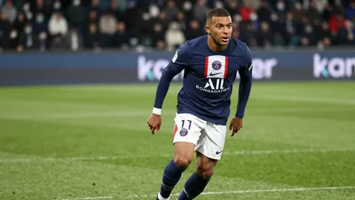 A photorealistic image of a 28-year-old, Franco-Algerian Paris FC player in a blue jersey with white shorts and black...